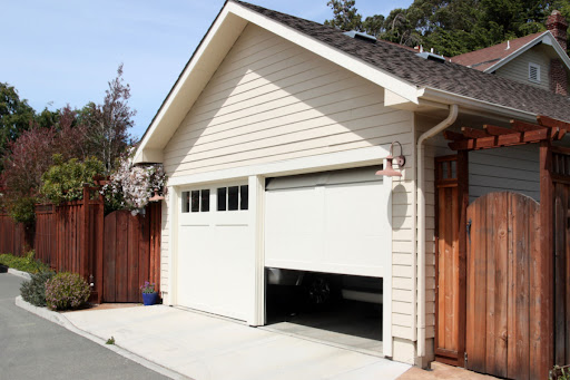A garage with a garage door that's partially open.